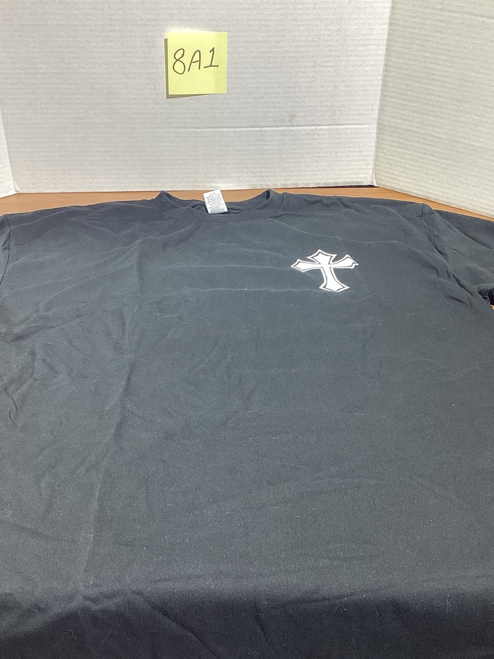 Pacifica Black Short-Sleeve Tee with White Cross Chest Graphic